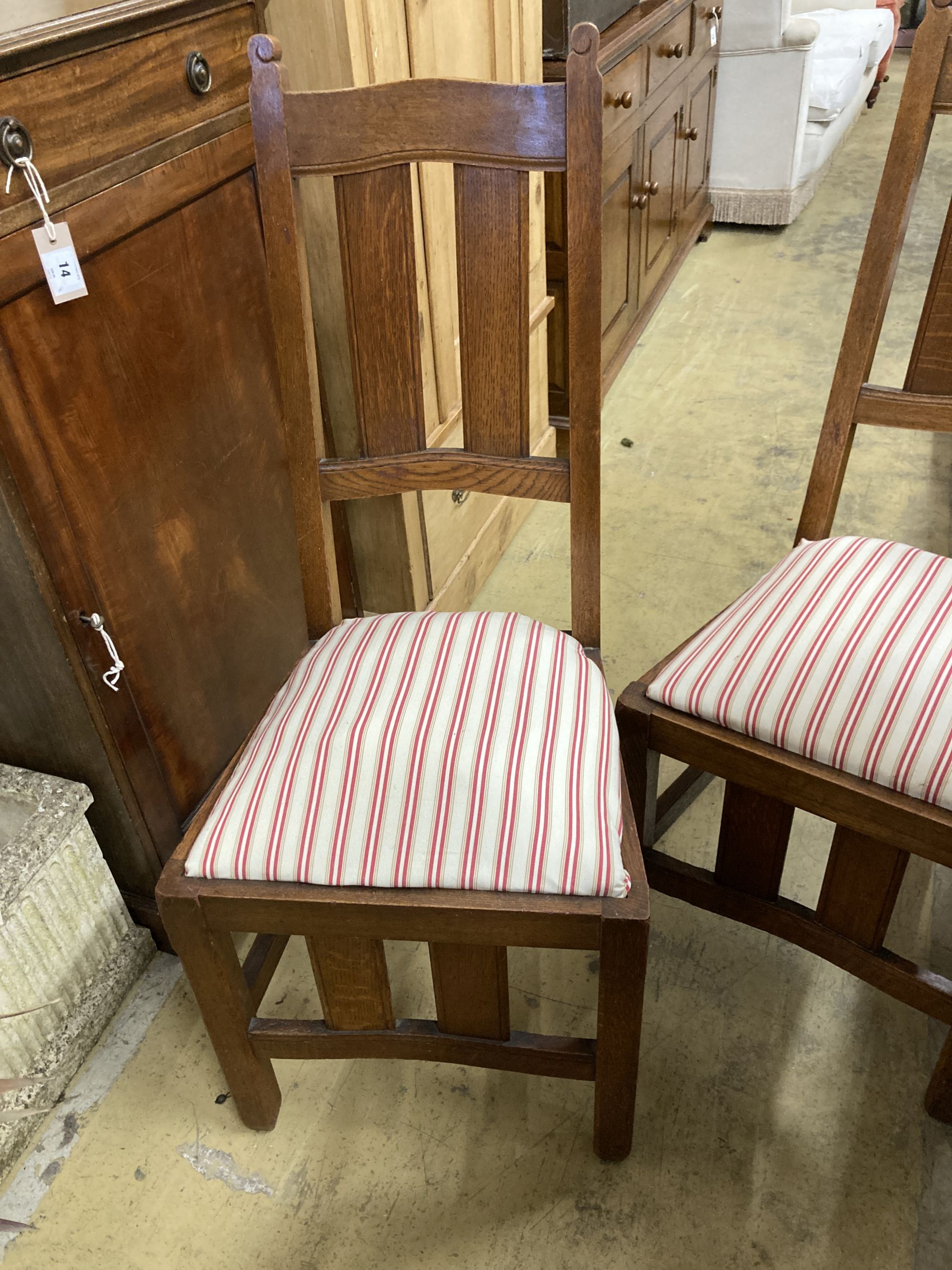 A set of six early 20th century oak Arts & Crafts style dining chairs